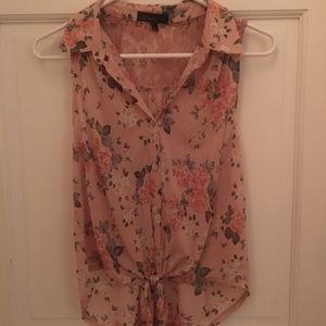 Sheer, floral, light pink collared sleeveless top.